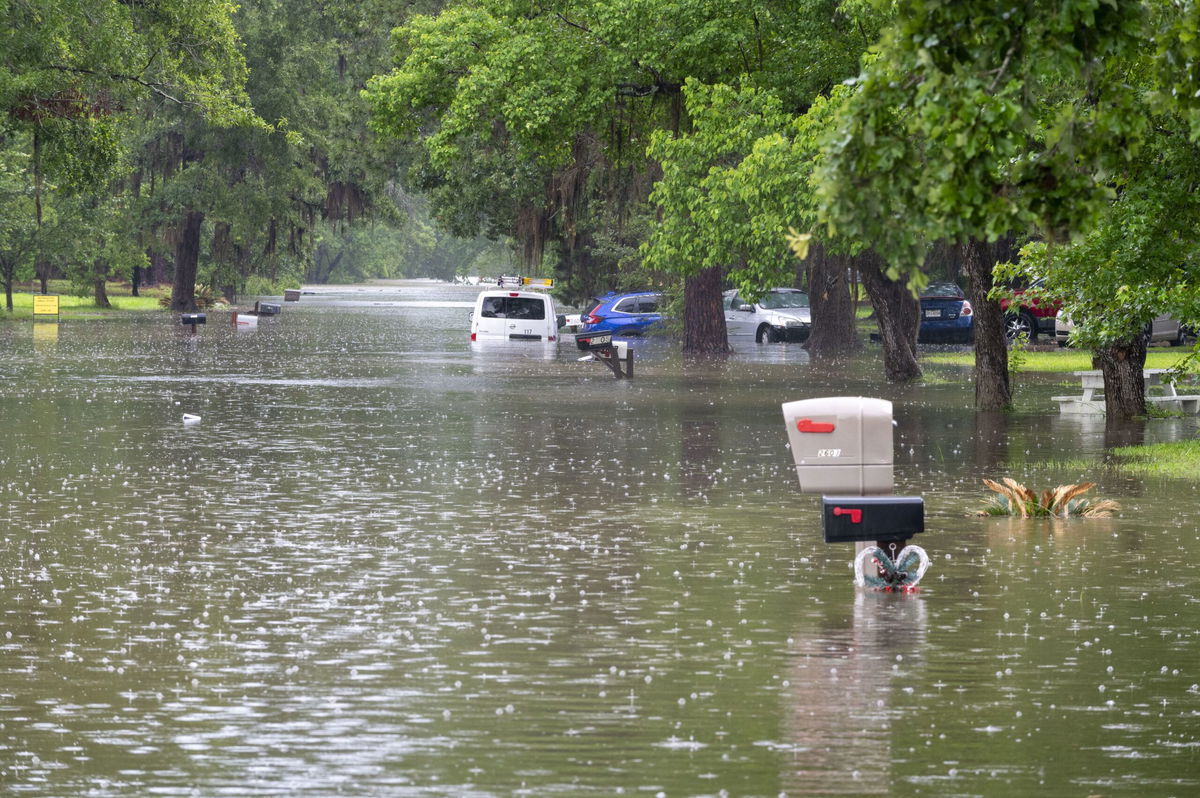 Floodwaters plunge a residential neighborhood underwater in Woodloch, Texas, in early May. Frequent flooding has impacted parts of Texas in recent weeks.
