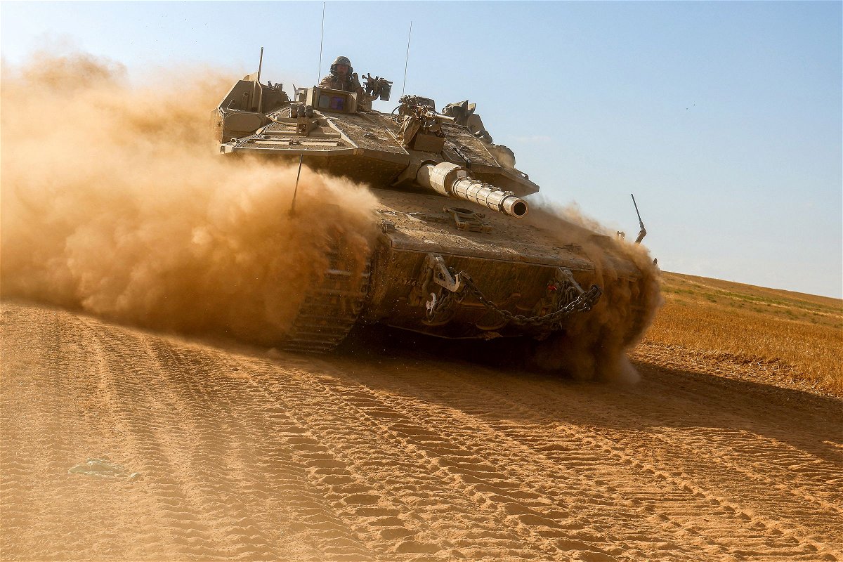 <i>Jack Guez/AFP/Getty Images via CNN Newsource</i><br />An Israeli army battle tank moves near the border with the Gaza Strip at a location in southern Israel on May 13