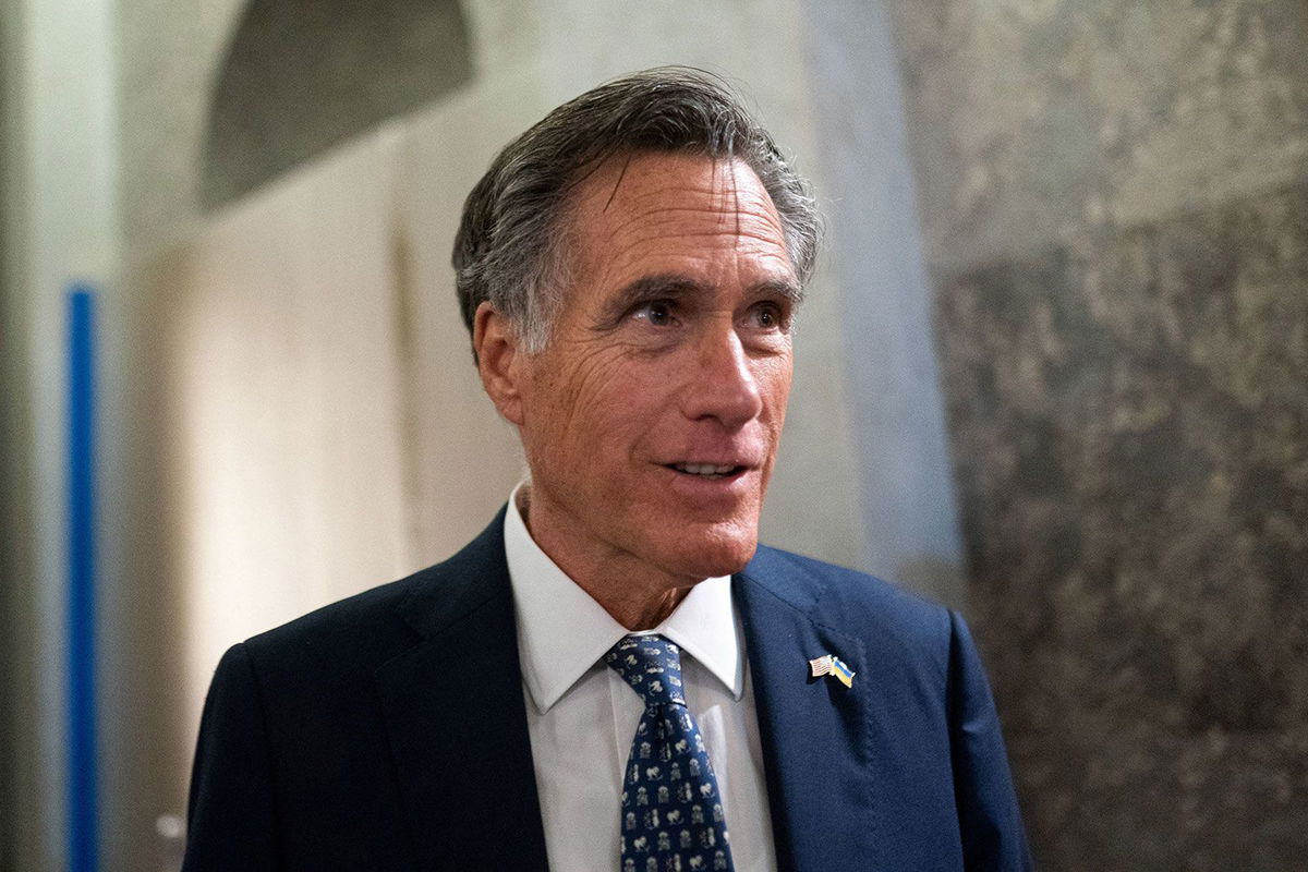 <i>Nathan Howard/Reuters/File via CNN Newsource</i><br/>U.S. Senator Mitt Romney speaks with members of the media ahead of a Senate vote to begin work on a bill that includes aid for Ukraine