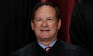 Associate Supreme Court Justice Samuel Alito poses for the official photo at the Supreme Court in Washington in October 2022. Alito drew sharp condemnation on May 17 following revelations that an upside-down American flag was flown outside his home after January 6