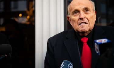 Rudy Giuliani speaks to reporters on January 21