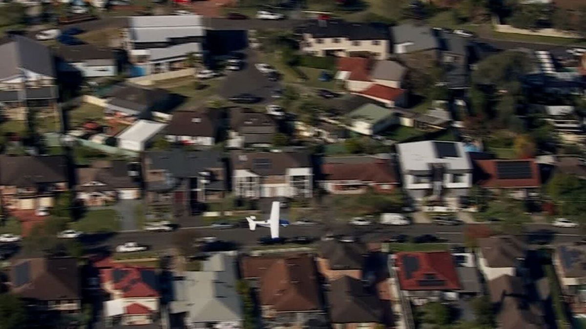 <i>Nine News (Must courtesy) via CNN Newsource</i><br/>The Cessna plane skimmed across homes and treetops in Sydney's southwest suburb.