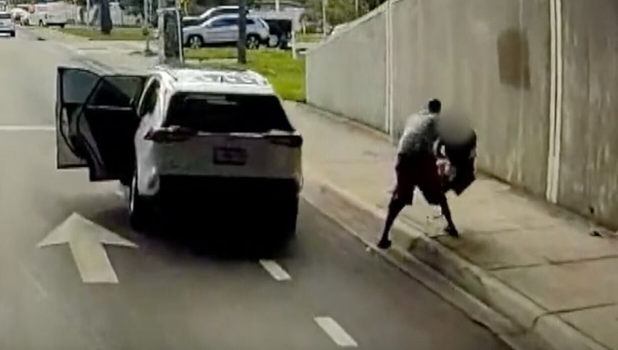 <i>Broward Sheriff's Office/WPTV via CNN Newsource</i><br/>The sheriff's office released surveillance video showing the carjacker pulling over on the side of a busy road