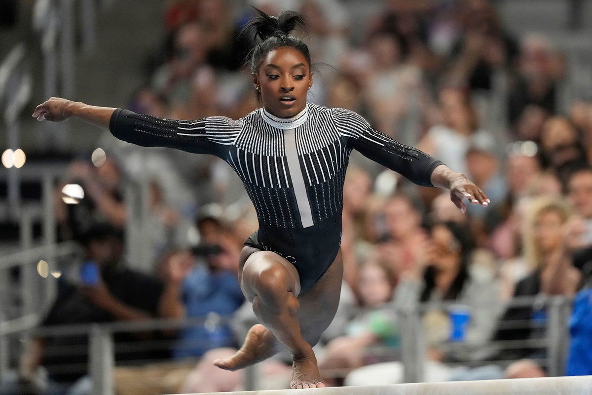 <i>Jim Cowsert/AP via CNN Newsource</i><br/>Simone Biles competes on the beam Friday in Fort Worth