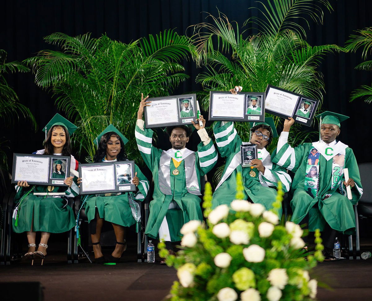 <i>Courtesy Kewe Ukpolo via CNN Newsource</i><br/>Walter L. Cohen High School principal Rhonda Dale poses with valedictorian Elijah Hogan.