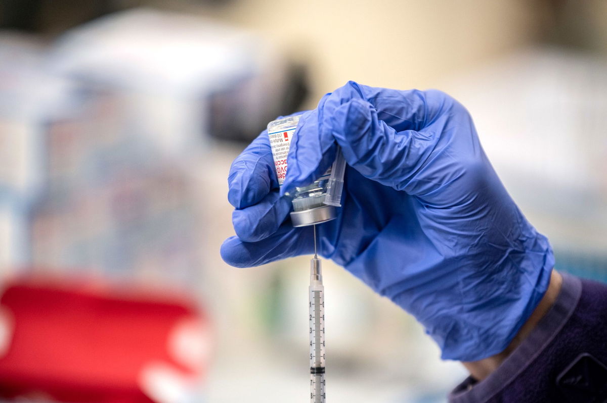 A nurse fills up a syringe with the Moderna Covid-19 vaccine in March 2021 in San Antonio, Texas. Vaccine maker Moderna announced on June 10 positive late-stage trial results for its Covid/flu combination vaccine it calls mRNA-1083.