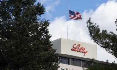A flag flies above the headquarters campus of Eli Lilly and Company on March 17
