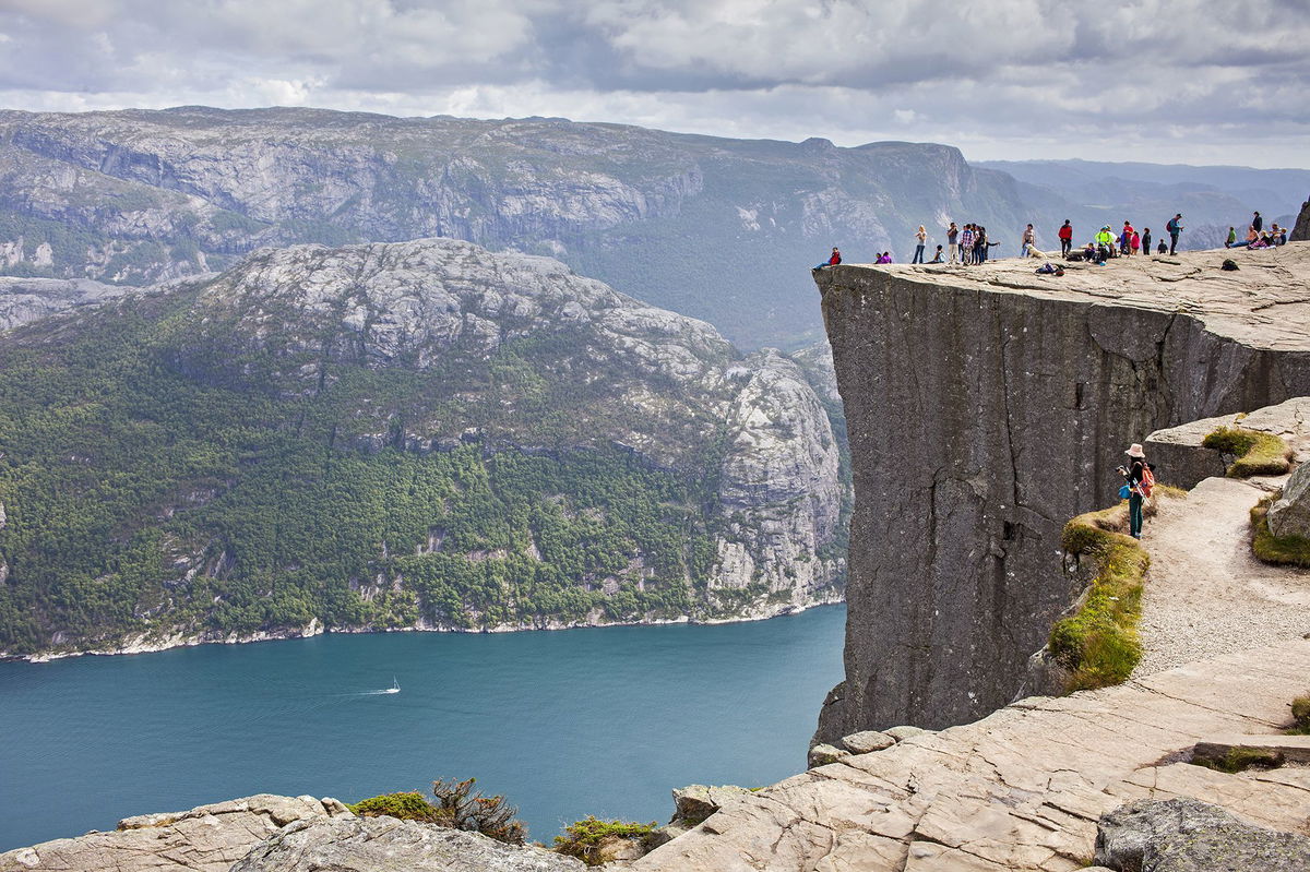 <i>Carina Johansen/NTB Scanpix/AFP/Getty Images via CNN Newsource</i><br/>People gather in the mountains near Preikestolen to see the movie 