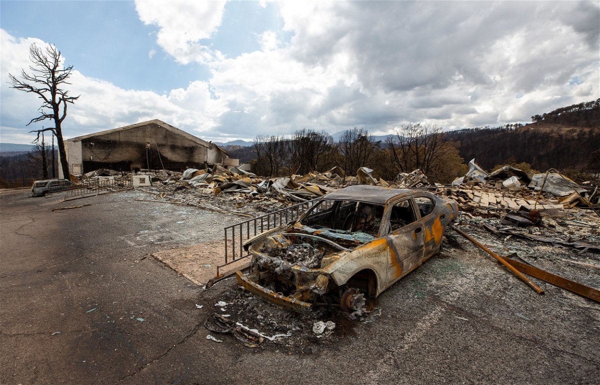 <i>Andres Leighton/AP via CNN Newsource</i><br />A car sits charred Saturday near the remains of the Swiss Chalet Hotel after both were destroyed by the South Fork Fire in the mountain village of Ruidoso