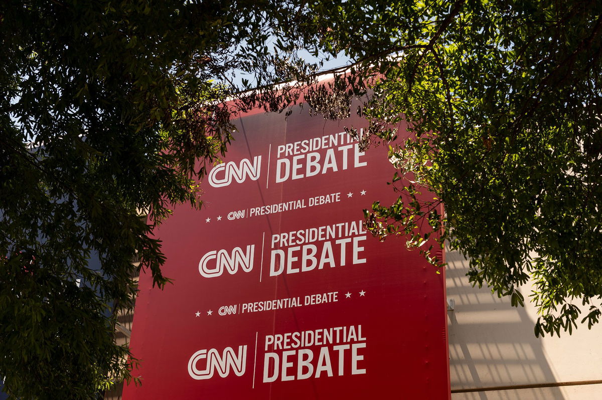 <i>Will Lanzoni/CNN via CNN Newsource</i><br/>Banners hang outside of CNN’s Atlanta headquarters ahead of CNN’s Presidential Debate between President Joe Biden and former President Donald Trump on June 24.