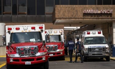 Ambulances are pictured outside of Howard University Hospital during high temperatures in Washington