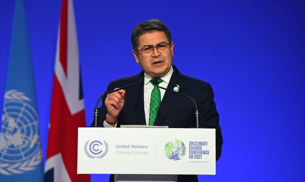 <i>Andy Buchanan/Getty Images via CNN Newsource</i><br/>Former Honduran President Juan Orlando Hernández speaks at the COP26 climate change conference in Scotland in November 2021. Juan Orlando Hernandez has been sentenced to 45 years in prison and given an $8 million fine by a US judge for drug trafficking offenses.