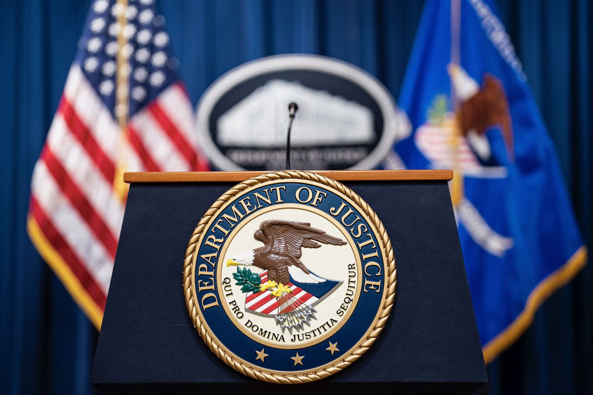 <i>Al Drago/Bloomberg/Getty Images via CNN Newsource</i><br/>Seal of the US Department of Justice before a news conference in Washington