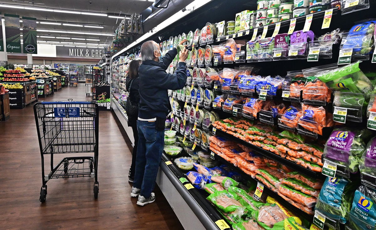 <i>Frederic J. Brown/AFP/Getty Images via CNN Newsource</i><br/>People shop at a supermarket in Montebello