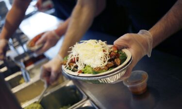 An employee prepares a burrito bowl at a Chipotle Mexican Grill Inc. restaurant in Louisville