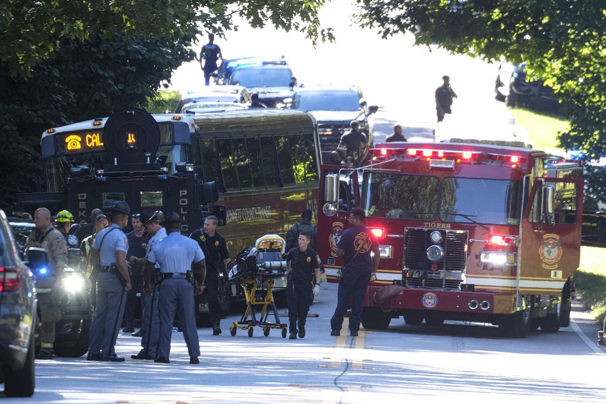 <i>Ben Gray/AP via CNN Newsource</i><br/>A hijacked commuter bus sits in the road where it was stopped after a lengthy police chase on June 11.