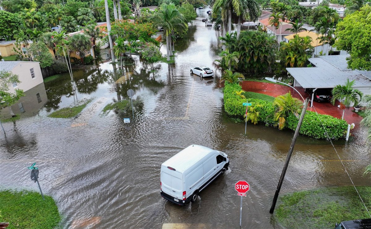 <i>Jim Watson/AFP/Getty Images via CNN Newsource</i><br/>An abandoned car sits submerged in flood waters near the Fort Lauderdale-Hollywood International Airport in Fort Lauderdale