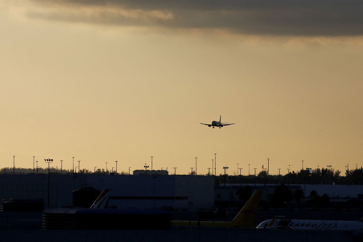 <i>Marco Bello/Reuters via CNN Newsource</i><br/>An aircraft approaches to land at Miami International Airport.