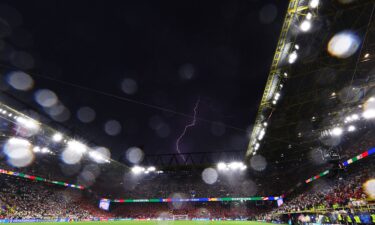 Lightning is seen above BVB Stadion during the Euro 2024 game between Germany and Denmark.