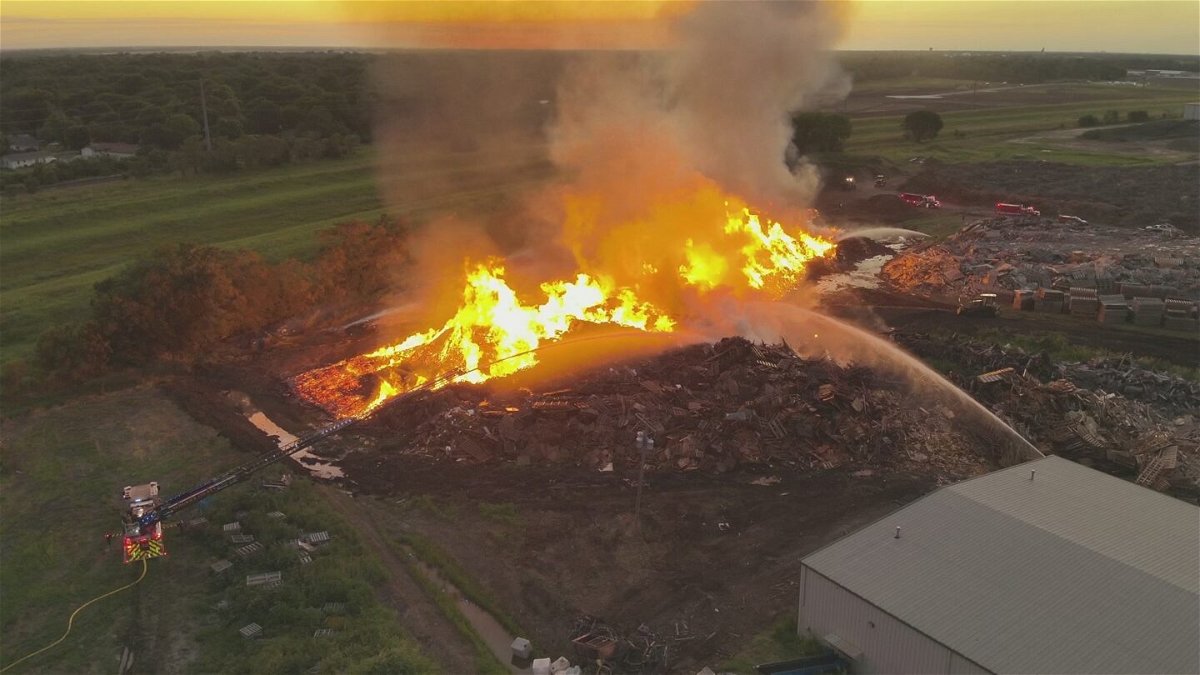 <i>Sedgwick County Fire District 1/Facebook/KAKE via CNN Newsource</i><br/>Crews continued battling a large fire at a recycling facility in Park City on Monday.