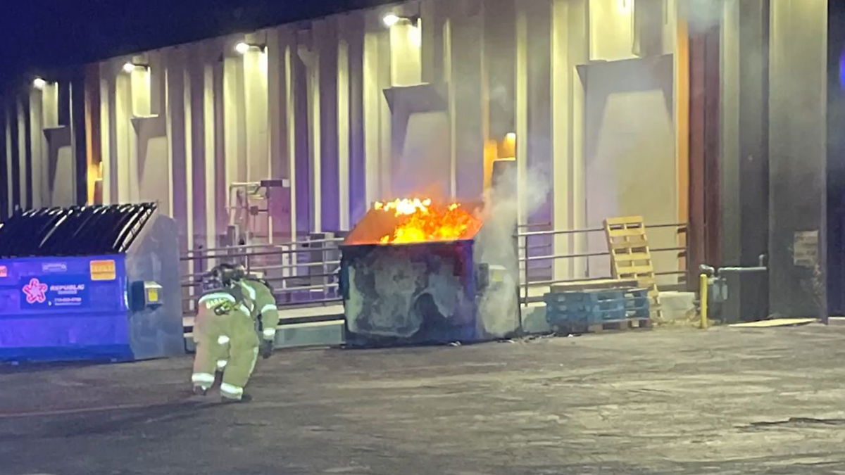 CSFD firefighters approaching a fire in a dumpster on the 4th.