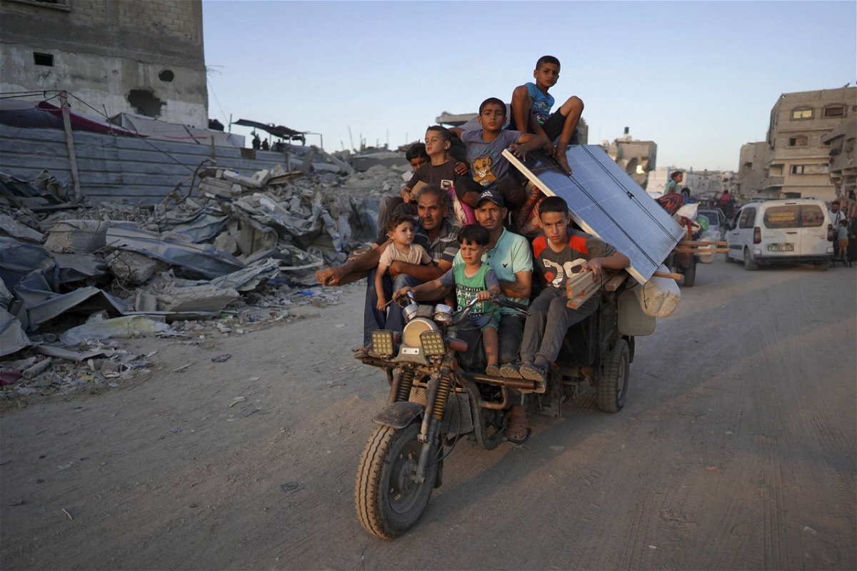<i>Bashar Taleb/AFP/Getty Images via CNN Newsource</i><br />Displaced Palestinians leave an area in east Khan Younis after the Israeli army issued a new evacuation order for parts of the city and Rafah