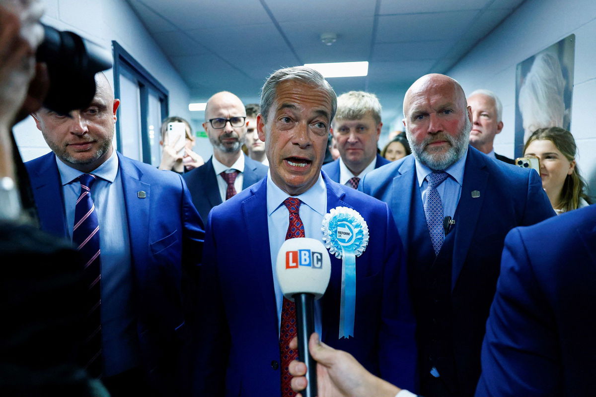 <i>Clodagh Kilcoyne/Reuters via CNN Newsource</i><br/>Britain's Reform UK Party Leader Nigel Farage speaks to the media after winning his first seat in parliament during the UK election in Clacton-on-Sea