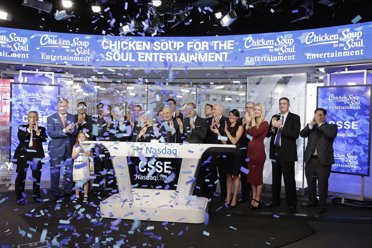 <i>Richard Drew/AP via CNN Newsource</i><br/>Chicken Soup for the Soul Entertainment executives ring the opening bell at the Nasdaq in 2017. The parent company of Redbox has filed for bankruptcy after enduring months of financial struggle.