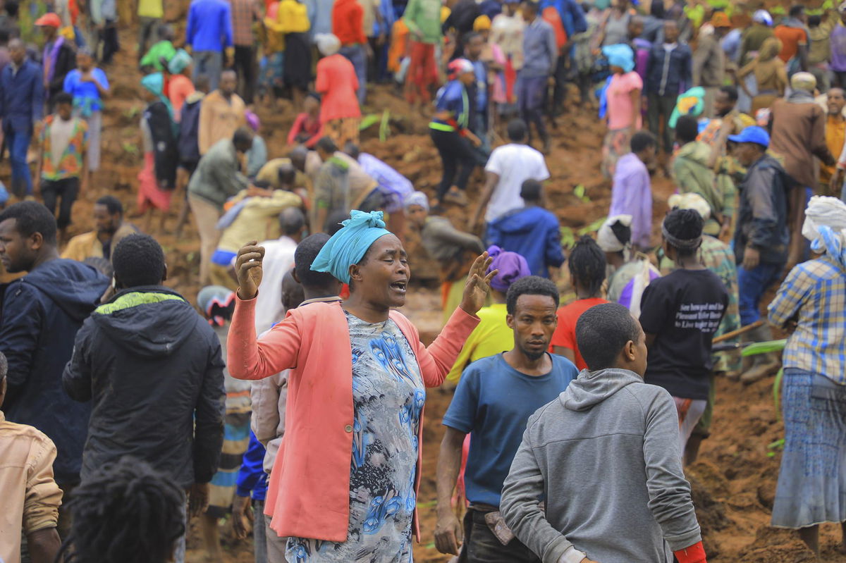 <i>Isayas Churga/Gofa Zone Government Communication Affairs Department/AP via CNN Newsource</i><br/>A woman cries as hundreds of people gather at the site of a mudslide.