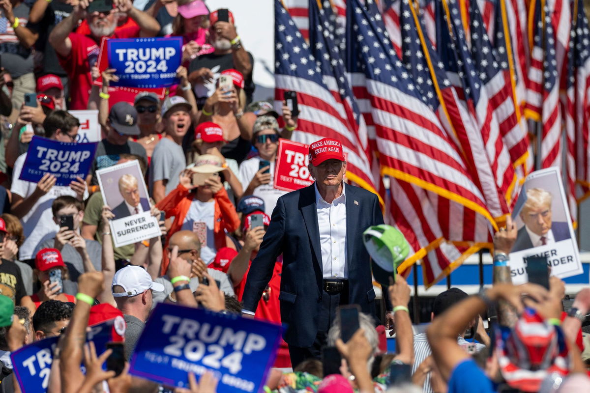 <i>Jim Watson/AFP/Getty Images via CNN Newsource</i><br />Former President Donald Trump walks onstage at a campaign rally in Chesapeake