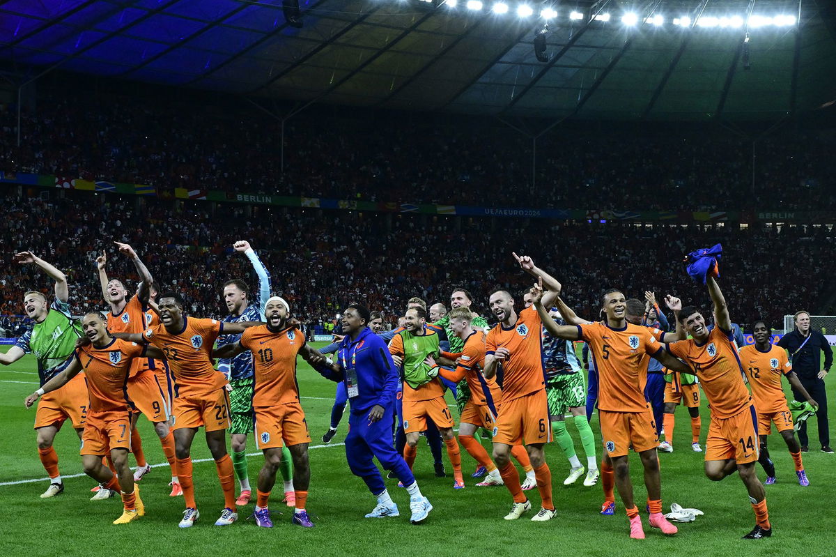 <i>John MacDougall/AFP/Getty Images via CNN Newsource</i><br/>Dutch players dance to 'Links Rechts' on the pitch after beating Turkey in the quarterfinals.