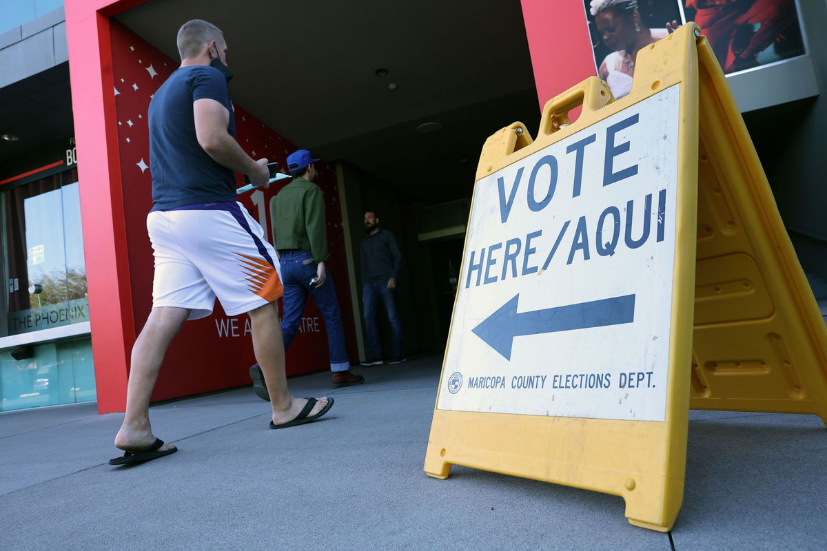 <i>Kevin Dietsch/Getty Images/File via CNN Newsource</i><br />Voters arrive to cast their ballots at the Phoenix Art Museum on November 8