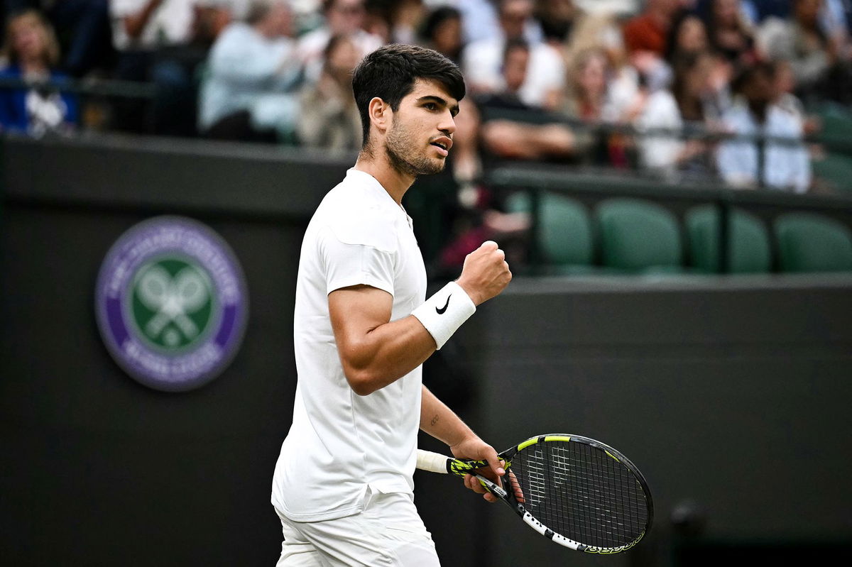 <i>Ben Stansall/AFP/Getty Images via CNN Newsource</i><br/>Carlos Alcaraz overcame a slow start to beat Tommy Paul in four sets on Tuesday and book his place in the Wimbledon semifinals.