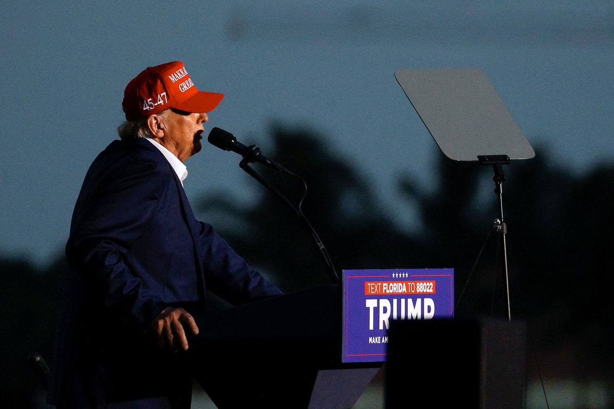 <i>Marco Bello/Reuters via CNN Newsource</i><br/>Former President Donald Trump speaks at a rally at his golf resort in Doral