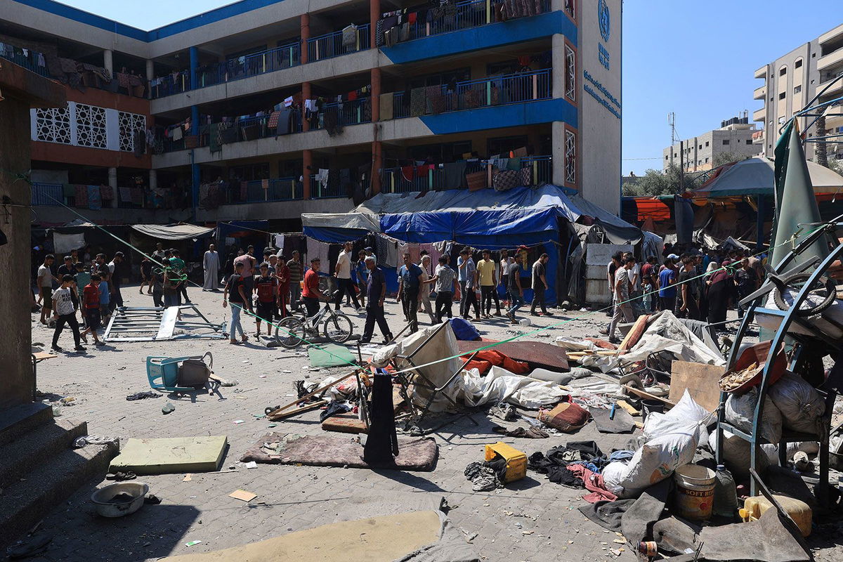 <i>Eyad Baba/AFP/Getty Images via CNN Newsource</i><br/>Palestinians survey the damage following the Israeli military bombardment of UNRWA's Abu Oraiban school on July 14