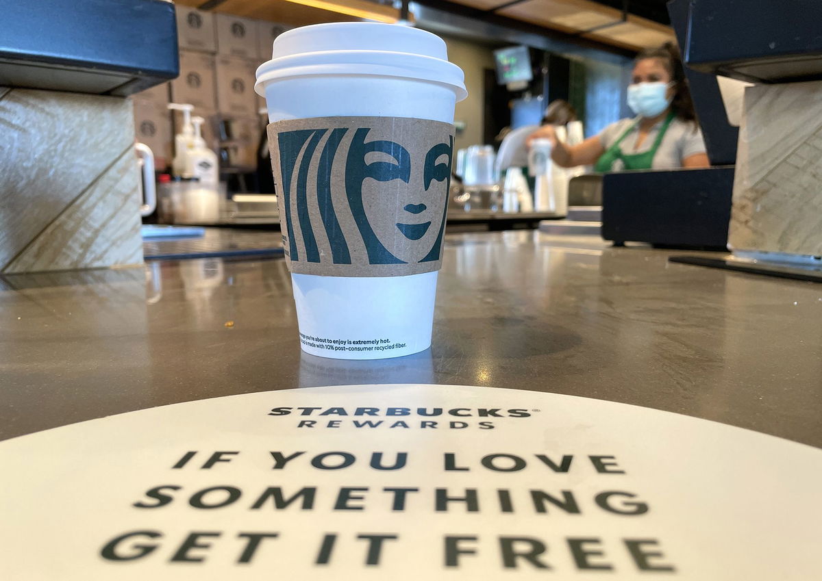 <i>Justin Sullivan/Getty Images via CNN Newsource</i><br />The Starbucks logo is displayed on a cup at a Starbucks store in October 2021 in Marin City