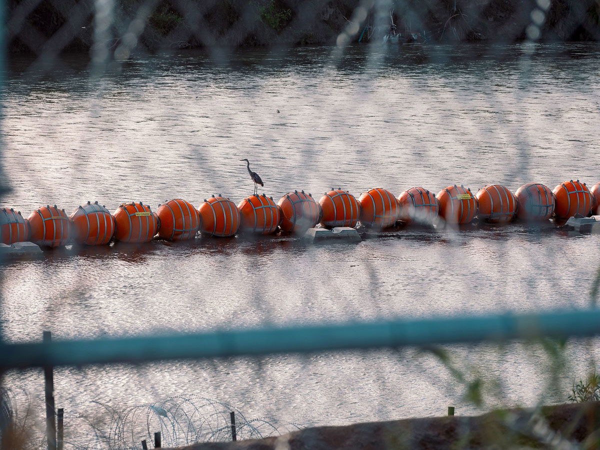 <i>Jordan Vonderhaar/Bloomberg/Getty Images/File via CNN Newsource</i><br/>Buoys meant to deter migrant crossings in the Rio Grande River in Eagle Pass