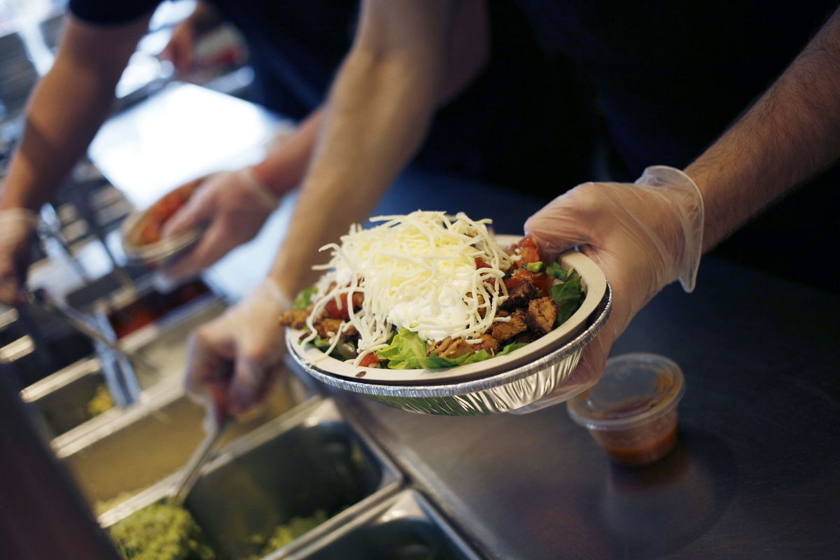 <i>Luke Sharrett/Bloomberg/Getty Images/File via CNN Newsource</i><br />An employee prepares a burrito bowl at a Chipotle Mexican Grill Inc. restaurant in Louisville