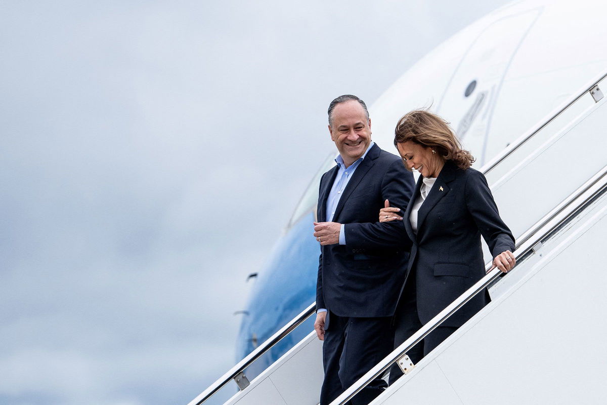 <i>Erin Schaff/Pool/Getty Images via CNN Newsource</i><br/>Vice President Kamala Harris and second gentleman Doug Emhoff descend from Air Force Two at Delaware National Air Guard base in New Castle