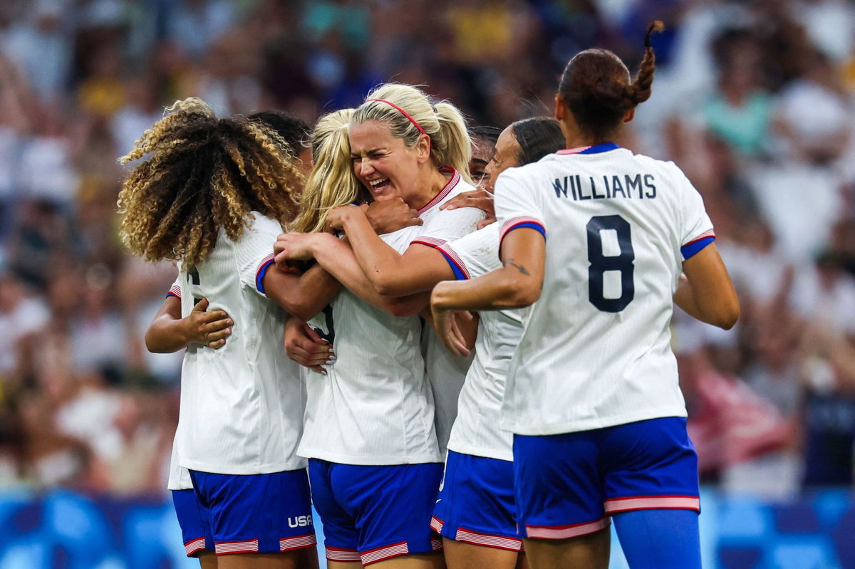 <i>Pascal Guyot/AFP/Getty Images via CNN Newsource</i><br />US players celebrate Korbin Albert's goal against Australia.