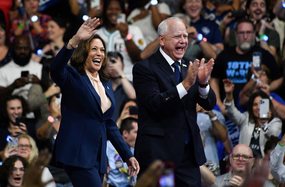 <i>Matthew Hatcher/AFP/Getty Images/File via CNN Newsource</i><br/>Vice President Kamala Harris and Minnesota Gov. Tim Walz greet supporters as they arrive at a rally in Philadelphia on August 6