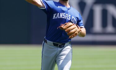 The Kansas City Royals' Paul DeJong talks to reporters shortly after being traded to the team from the Chicago White Sox.