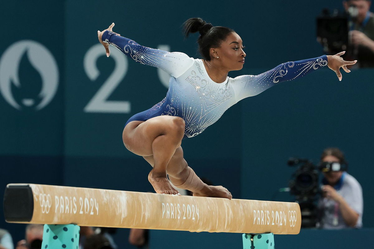 <i>Daniela Porcelli/Eurasia Sport Images/Getty Images via CNN Newsource</i><br/>US gymnasts Simone Biles and Jordan Chiles celebrate gold medalist Rebeca Andrade of Brazil during the medal ceremony after the women's floor exercise final on August 5