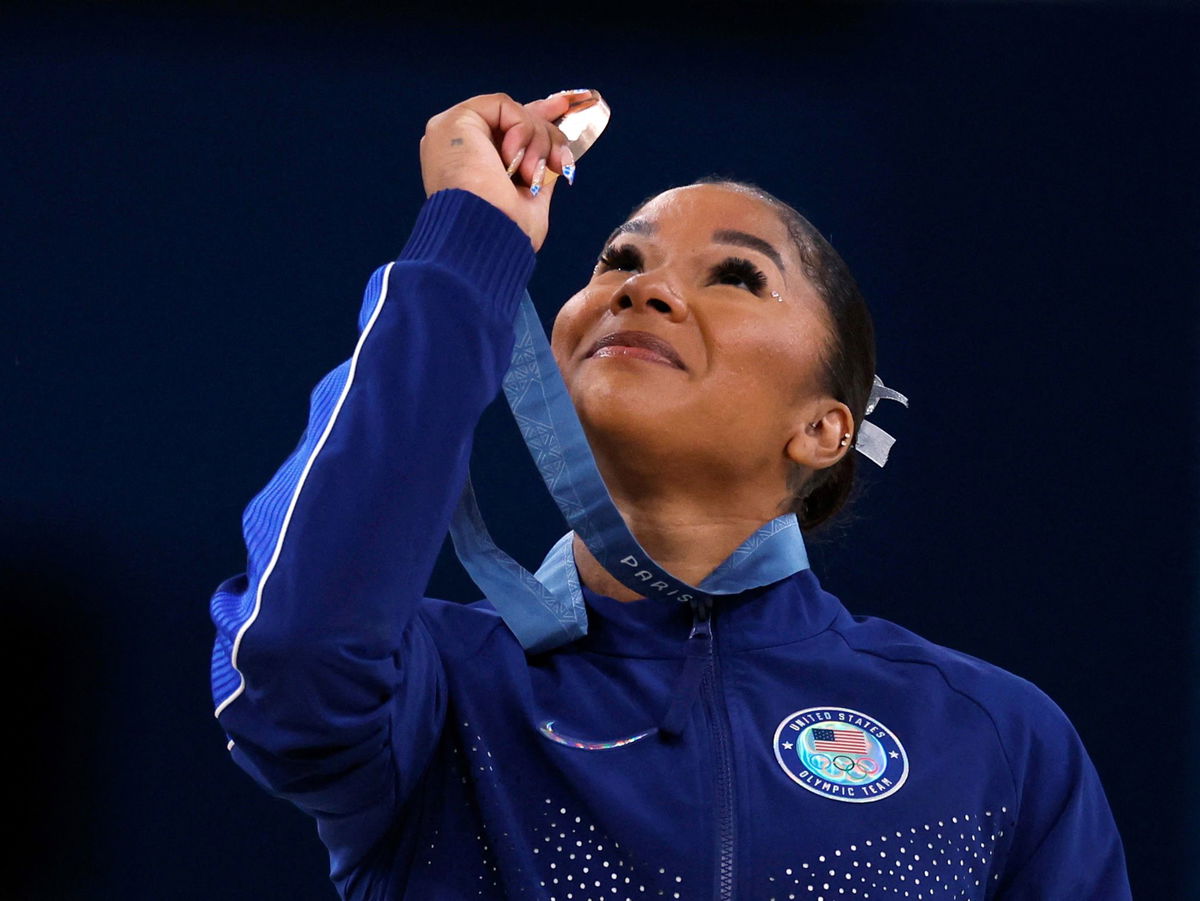 <i>Amanda Perobelli/Reuters via CNN Newsource</i><br />American gymnast Jordan Chiles looks at her bronze medal after the floor event on August 5.