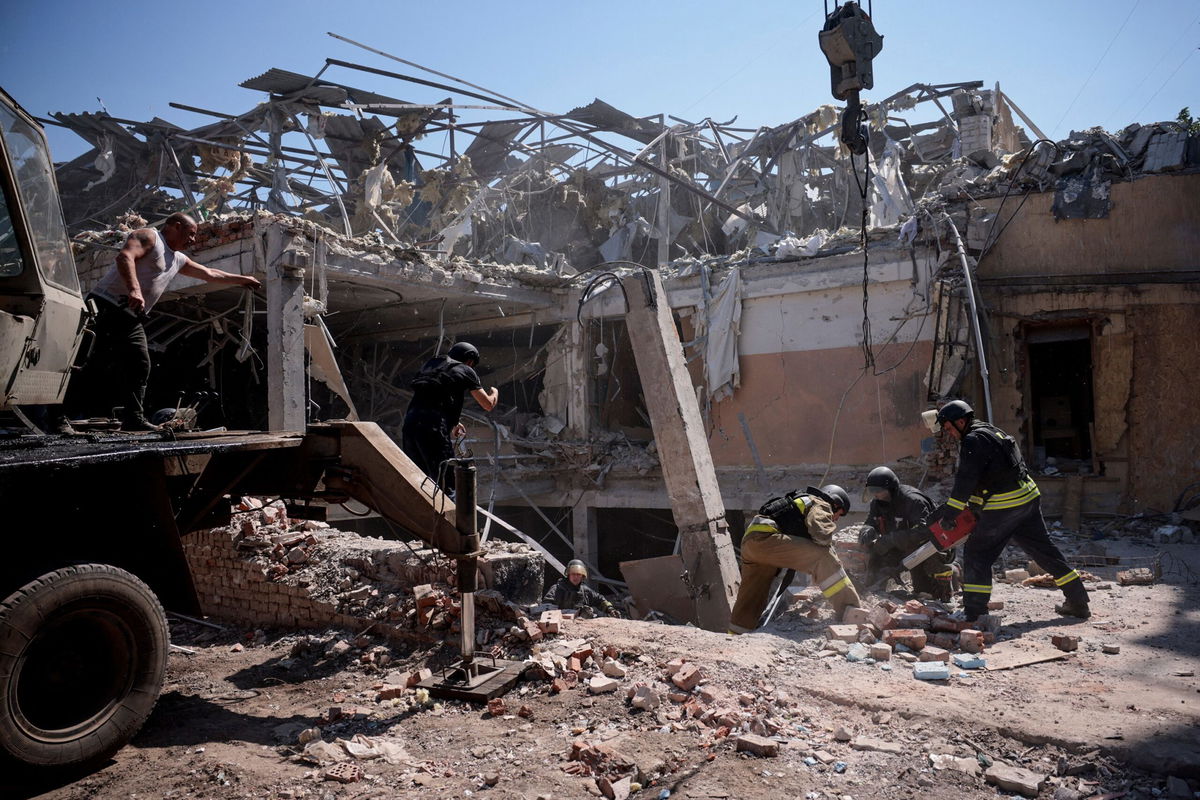 <i>Thomas Peter/Reuters via CNN Newsource</i><br />A man walks among debris inside the hotel targeted by a Russian missile.