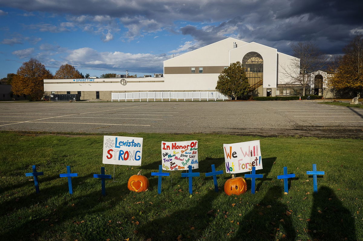 <i>Erin Clark/The Boston Globe/Getty Images via CNN Newsource</i><br/>Homemade crosses and signs in front of Just-In-Time Recreation on October 28