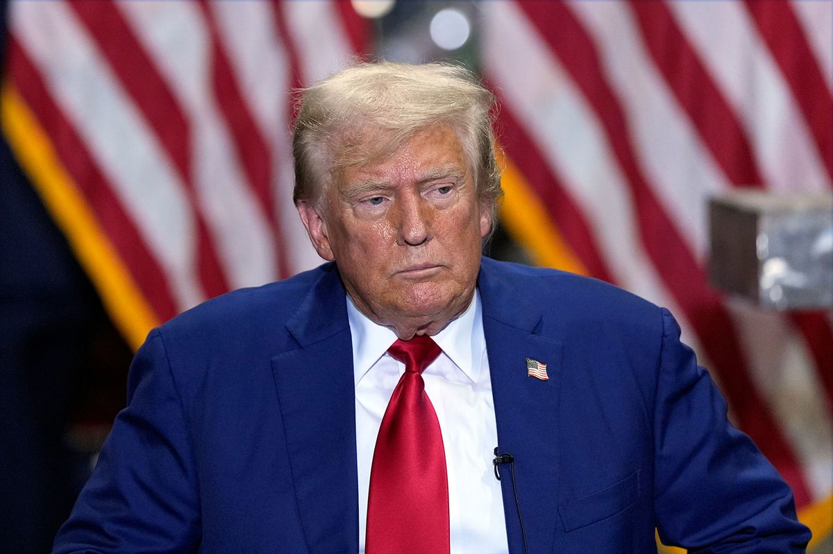 <i>Julia Nikhinson/AP via CNN Newsource</i><br/>Republican presidential nominee former President Donald Trump listens at a business roundtable discussion at a campaign event at Precision Components Group