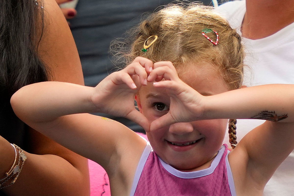 <i>Julia Nikhinson/AP via CNN Newsource</i><br/>Aryna Sabalenka signs autographs for fans