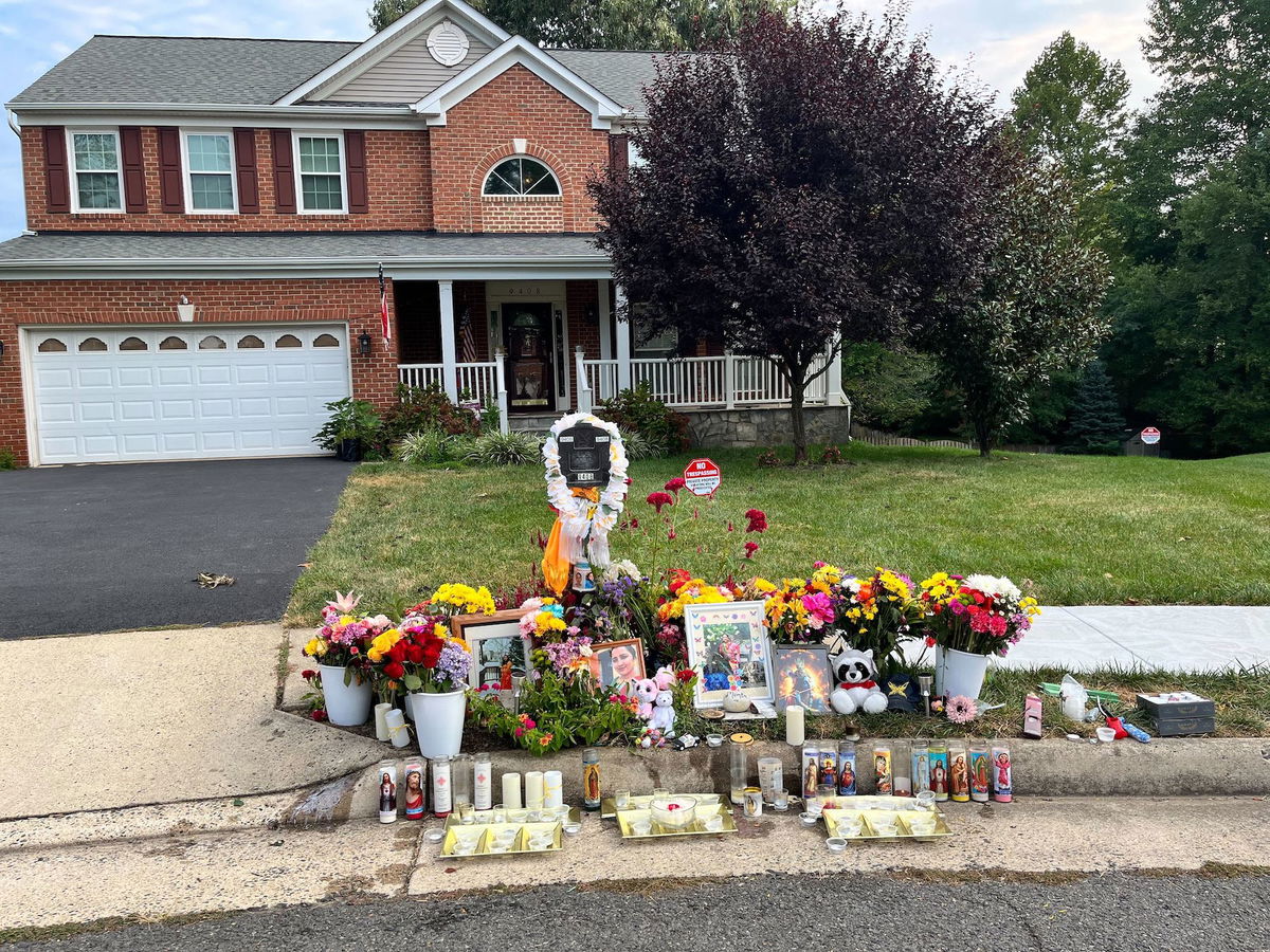 <i>Alisha Ebrahimji/CNN via CNN Newsource</i><br/>A makeshift memorial stands outside the Bhatt family home on August 29 after Naresh Bhatt is accused of killing his wife in their home then dragging her body outside