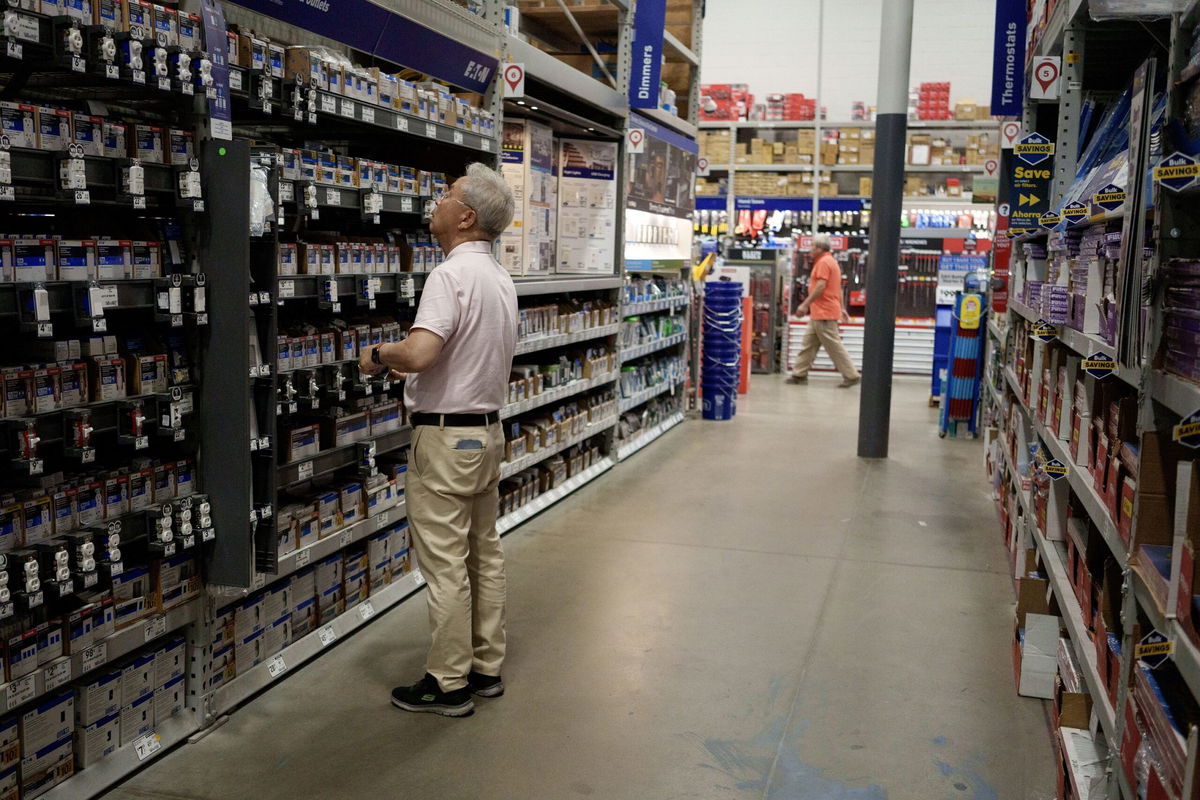 <i>Eric Thayer/Getty Images via CNN Newsource</i><br/>A customer shops in a Lowe's home improvement store on August 20